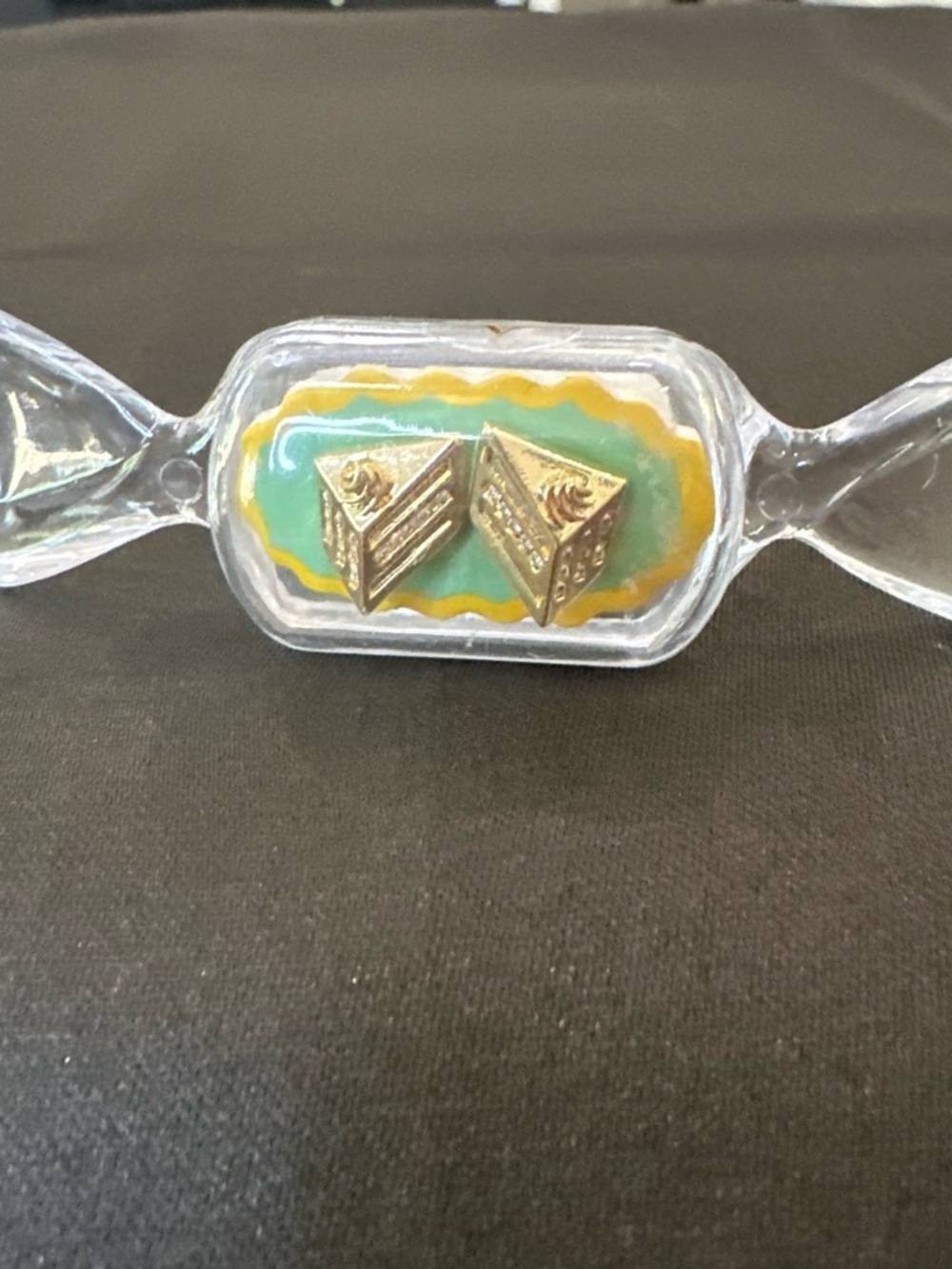 Vintage Gold Pyramid Stud Earrings on Teal & Yellow Display